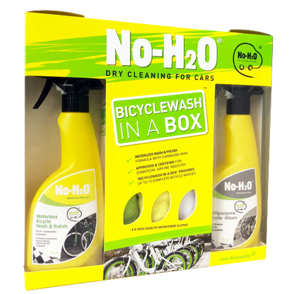 A product packaging for "No-H2O," which offers dry cleaning for cars. The package is labeled "BICYCLEWASH IN A BOX." The box includes two yellow bottles: one for waterless bicycle wash & polish and another for multipurpose bicycle cleaning. There are also features listed on the box, such as "up to 10 complete bike washes." The design also mentions it's eco-friendly and comes with a microfiber cloth.