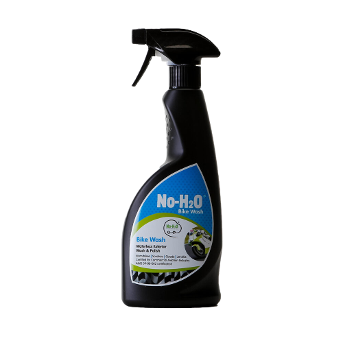 A "No-H2O" spray bottle labeled "Bike Wash." The label indicates it's a waterless bicycle wash & polish that also acts as a harden remover. The design features an image of a clean bike, emphasising its eco-friendly properties.