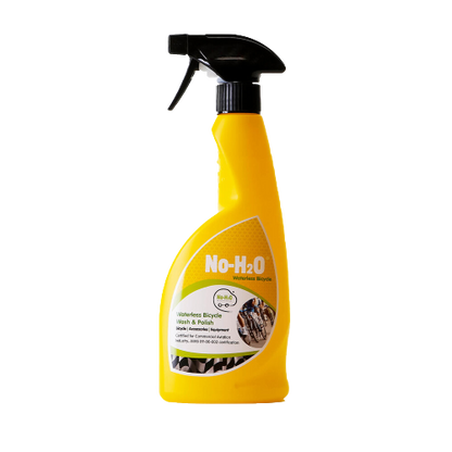 A "No-H2O" waterless bicycle wash & polish spray bottle. The product is designed for cleaning bicycles without the need for water. The bottle is yellow with a spray nozzle. The label emphasises its waterless cleaning properties and mentions its suitability for bicycles specifically.