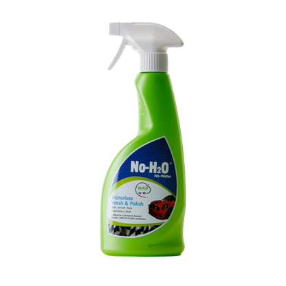A "No-H2O" product labeled as "Waterless Wash & Polish." The spray bottle indicates that it's designed for cleaning and polishing without the need for water, which is also emphasised by the "No Water" label. The green bottle features an image of a car, suggesting its primary use for vehicle cleaning. The overall design promotes the product's eco-friendly nature due to its waterless cleaning capability.