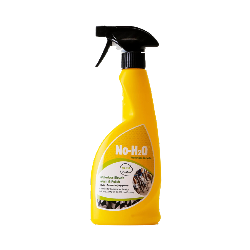 A product named "No-H2O." It's a waterless bicycle wash and polish spray. The bright yellow bottle is equipped with a black trigger sprayer. The label depicts a group of bicyclists in action, underscoring its primary usage. Notably, the product is certified for commercial aviation industry standards, as indicated by its "AMS-QQ-002 certification" on the label. This suggests it meets certain quality and performance standards.