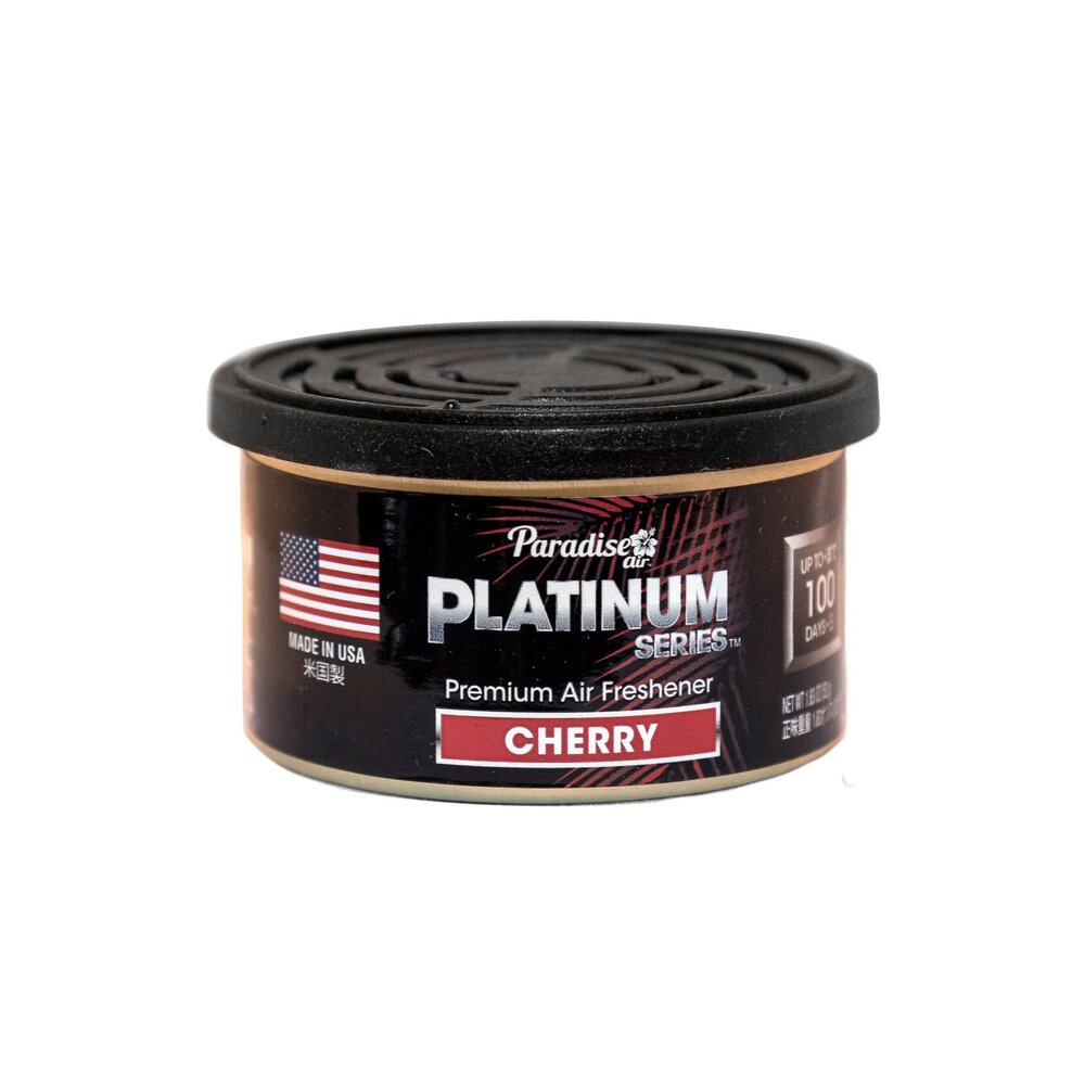 This is a container of "Paradise Platinum Series" premium air freshener. The scent is labelled as "Cherry." The product boasts of being made in the USA and claims to have a duration of up to 100 days.